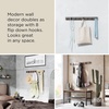image:imageUmbra Flip Coat Rack Wall Mount 8Hook Space Saving White  Real wood and steel build retractable hooks fold flat holds coats bags and scarves easy installWhiteNickel