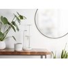 image:imageUmbra Hubba Round Wall Mirror Circle Decor Mirror 34Inch Titanium  Metallic frame glass construction reflects light to brighten enlarges small rooms