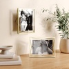image:imageUmbra Prisma Picture Frame Floating Metal Wall Mount 5x7 Brass  Steel wire construction unique geometric shape displays photo between glass desk or tabletop use hardware includedBrass