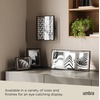 image:imageUmbra Prisma Picture Frame Floating Metal Wall Mount 5x7 Brass  Steel wire construction unique geometric shape displays photo between glass desk or tabletop use hardware includedBlack