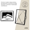 image:imageUmbra Prisma Picture Frame Floating Metal Wall Mount 5x7 Brass  Steel wire construction unique geometric shape displays photo between glass desk or tabletop use hardware includedBlack
