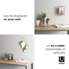 image:imageUmbra Prisma Picture Frame Floating Metal Wall Mount 5x7 Brass  Steel wire construction unique geometric shape displays photo between glass desk or tabletop use hardware includedCopper