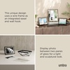 image:imageUmbra Prisma Picture Frame Floating Metal Wall Mount 5x7 Brass  Steel wire construction unique geometric shape displays photo between glass desk or tabletop use hardware includedBlack
