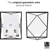 image:imageUmbra Prisma Picture Frame Floating Metal Wall Mount 5x7 Brass  Steel wire construction unique geometric shape displays photo between glass desk or tabletop use hardware includedBlack