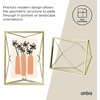 image:imageUmbra Prisma Picture Frame Floating Metal Wall Mount 5x7 Brass  Steel wire construction unique geometric shape displays photo between glass desk or tabletop use hardware includedBrass
