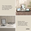 image:imageUmbra Prisma Picture Frame Floating Metal Wall Mount 5x7 Brass  Steel wire construction unique geometric shape displays photo between glass desk or tabletop use hardware includedBlack