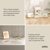 image:imageUmbra Prisma Picture Frame Floating Metal Wall Mount 5x7 Brass  Steel wire construction unique geometric shape displays photo between glass desk or tabletop use hardware includedBrass
