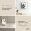image:imageUmbra Prisma Picture Frame Floating Metal Wall Mount 5x7 Brass  Steel wire construction unique geometric shape displays photo between glass desk or tabletop use hardware includedChrome