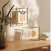 image:imageUmbra Prisma Picture Frame Floating Metal Wall Mount 5x7 Brass  Steel wire construction unique geometric shape displays photo between glass desk or tabletop use hardware includedBrass