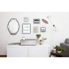image:imageUmbra Prisma Picture Frame Floating Metal Wall Mount 5x7 Brass  Steel wire construction unique geometric shape displays photo between glass desk or tabletop use hardware includedBlack