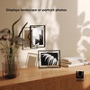 image:imageUmbra Prisma Picture Frame Floating Metal Wall Mount 5x7 Brass  Steel wire construction unique geometric shape displays photo between glass desk or tabletop use hardware includedBlack