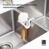 image:imageUmbra Sling Flexible Sink Caddy Elastic NonSlip Sponge Holder White  Rubber material perforated base for drainage prevents moisture buildup fits faucet necks easy rinse clean
