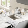 image:imageUmbra Sling Sink Caddy Sponge Holder with Dish Soap Pump White  Allinone organizer removable divider water catching tray 500 ml capacity recycled plastic