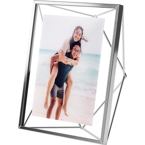 image:imageUmbra Prisma Picture Frame Floating Metal Wall Mount 5x7 Brass  Steel wire construction unique geometric shape displays photo between glass desk or tabletop use hardware includedChrome