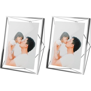 image:imageUmbra Prisma Picture Frame Floating Metal Wall Mount 5x7 Brass  Steel wire construction unique geometric shape displays photo between glass desk or tabletop use hardware includedcromado